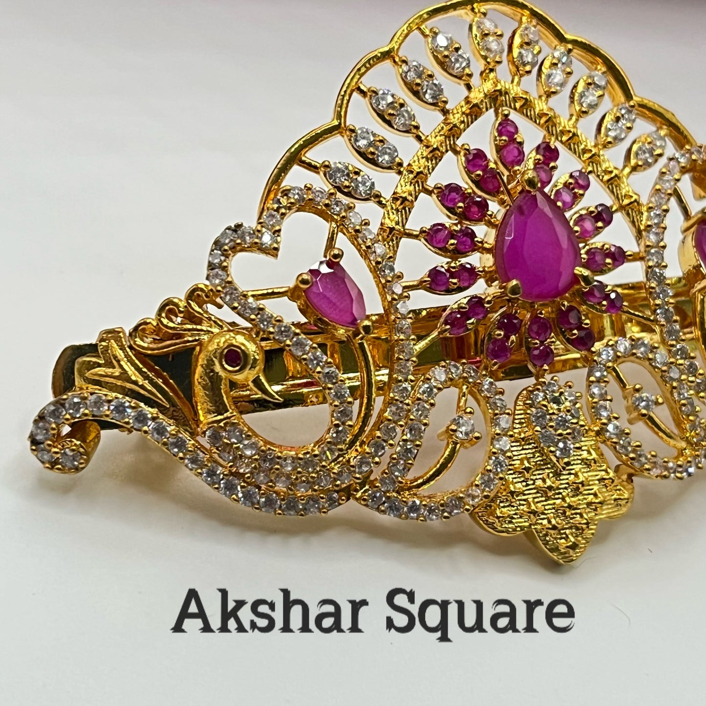 Gold finish peacock hair clip