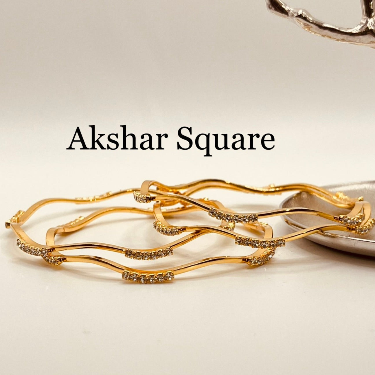 AD gold Bangles