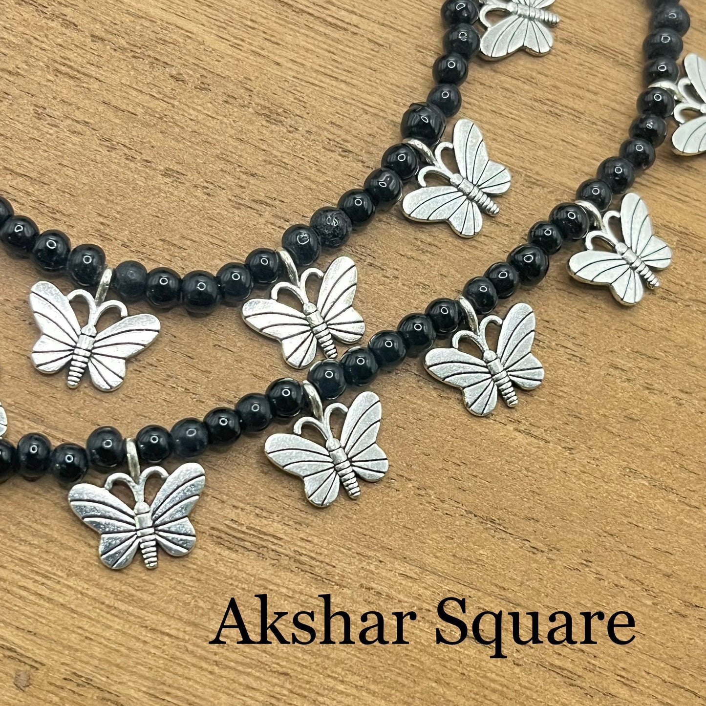 Black bead butterfly anklets
